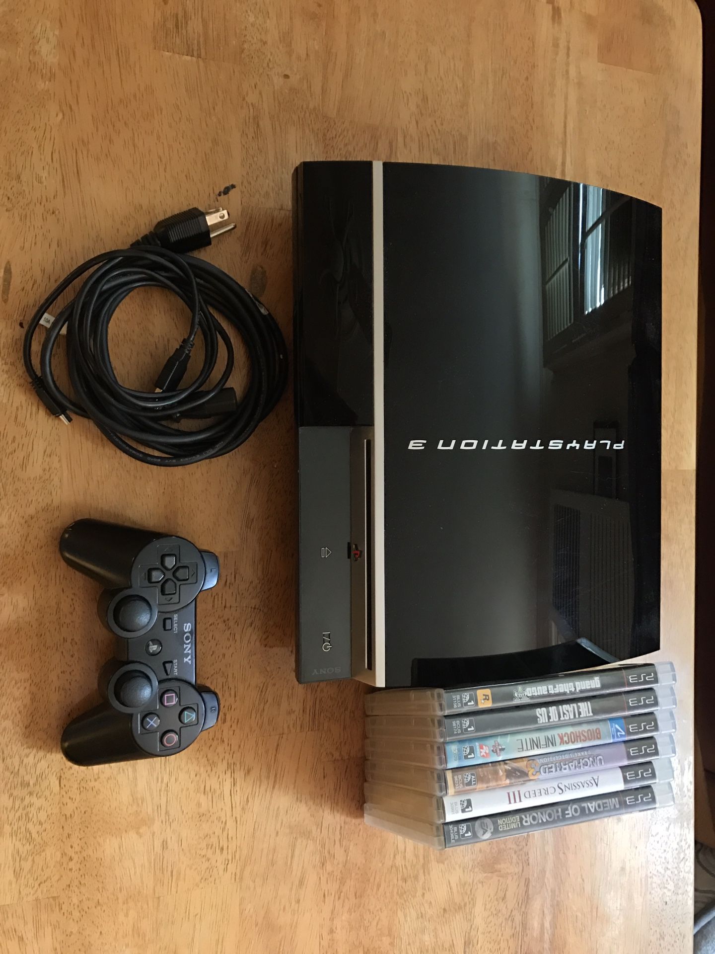 PS3 + CONTROLLER + 6 GAMES