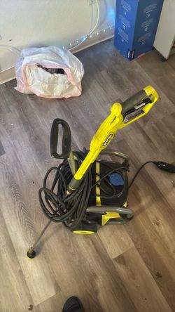 A Ryobi electric pressure washer (such as the 2000 PSI model