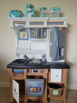 Toy kitchen in good condition for pretend play with  accessories