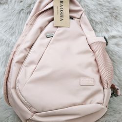 Brand new waterfront nylon pink sling bag cross over backpack. 