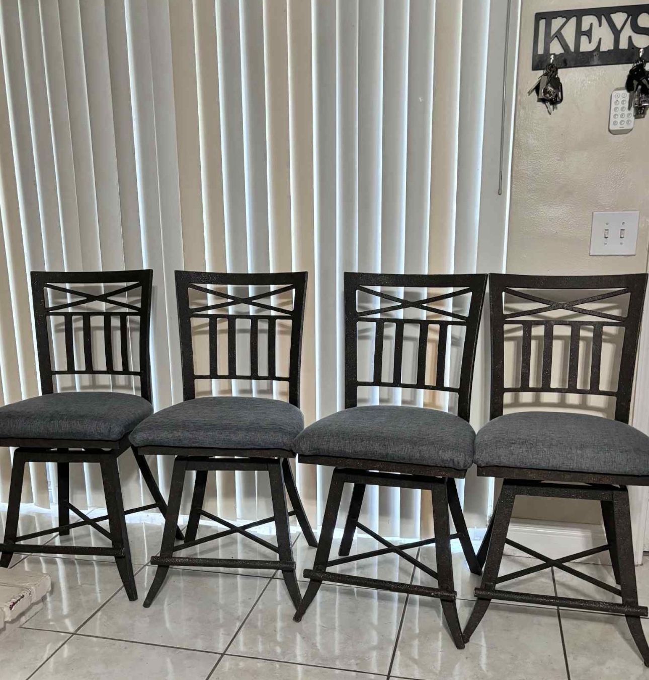 4 Wrought-Iron Swivel Bar Stools