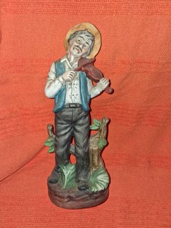And old man playing the harmonica