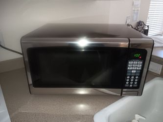 This is a black and silver microwave. In great working condition. Has staining on the inside top.  Works perfect. Selling for $35