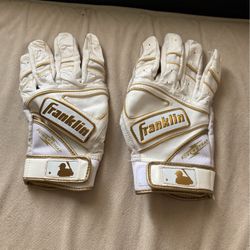 gold and white franklin batting gloves