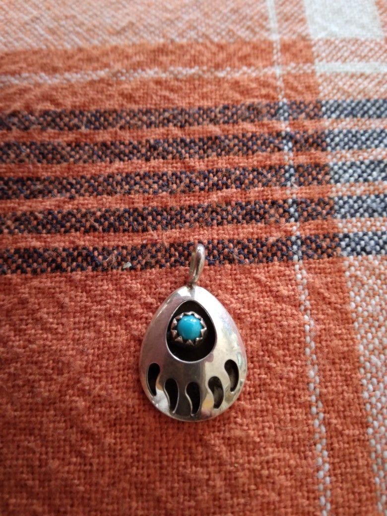 Silver Bear Claw With Small Turquoise Pendant.