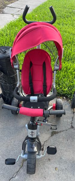 Red bicycle with canopy