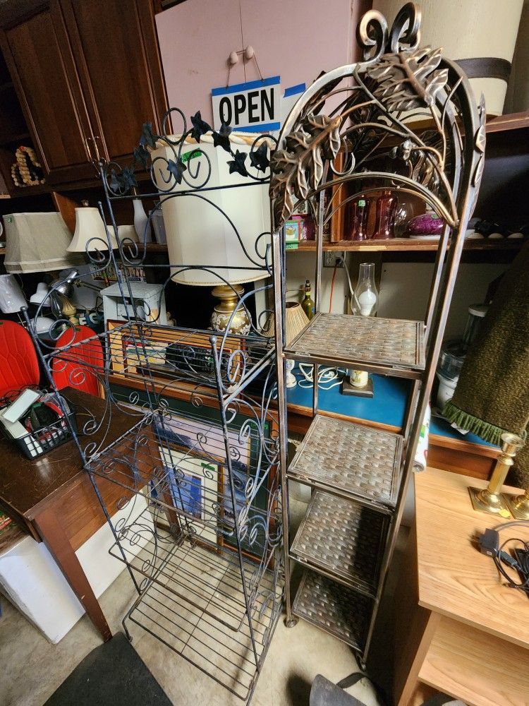 Three different 5' tall plant stands $50 ea. Four tiers, metal, shelves can fold up for moving.