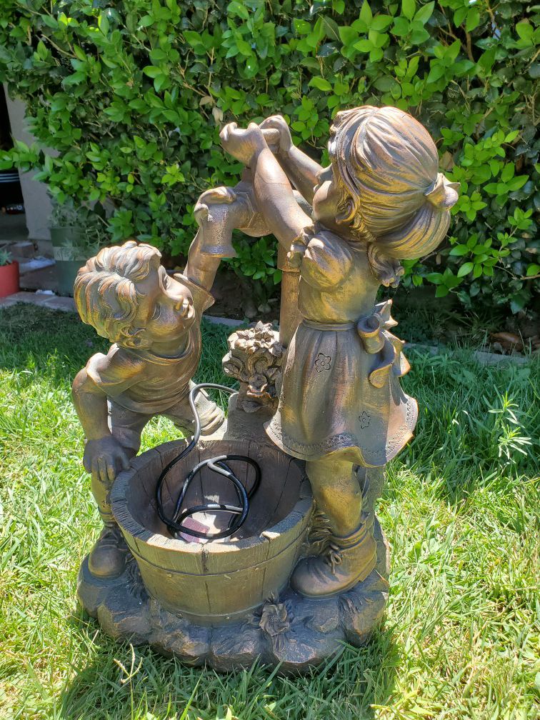 Brand new resin fun and play water fountain 27 inches tall