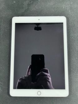 iPad Air 2 (9.7") - 64GB storage, Wi-Fi + Cellular, Silver. Released 2014.