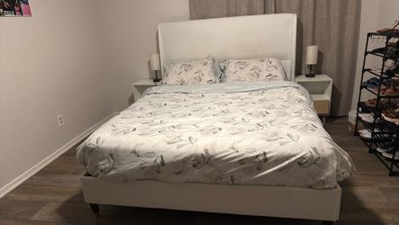 Bed frame, mattress and 2 night stands and the table lamp.