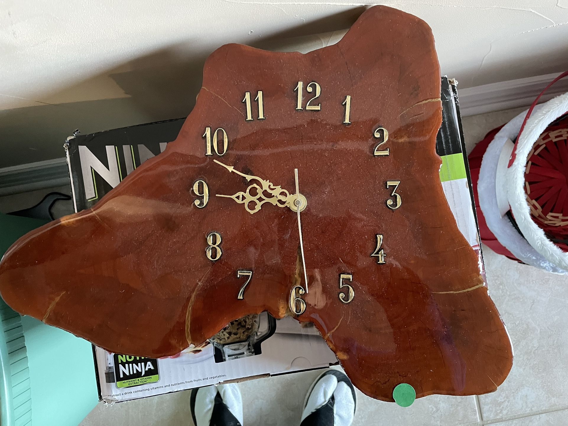 Hand cut Wooden clock. It is finished with light lacquer to preserve and enhance the wood coloring.