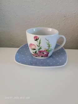 Floral teacup and blue polka dot saucer.