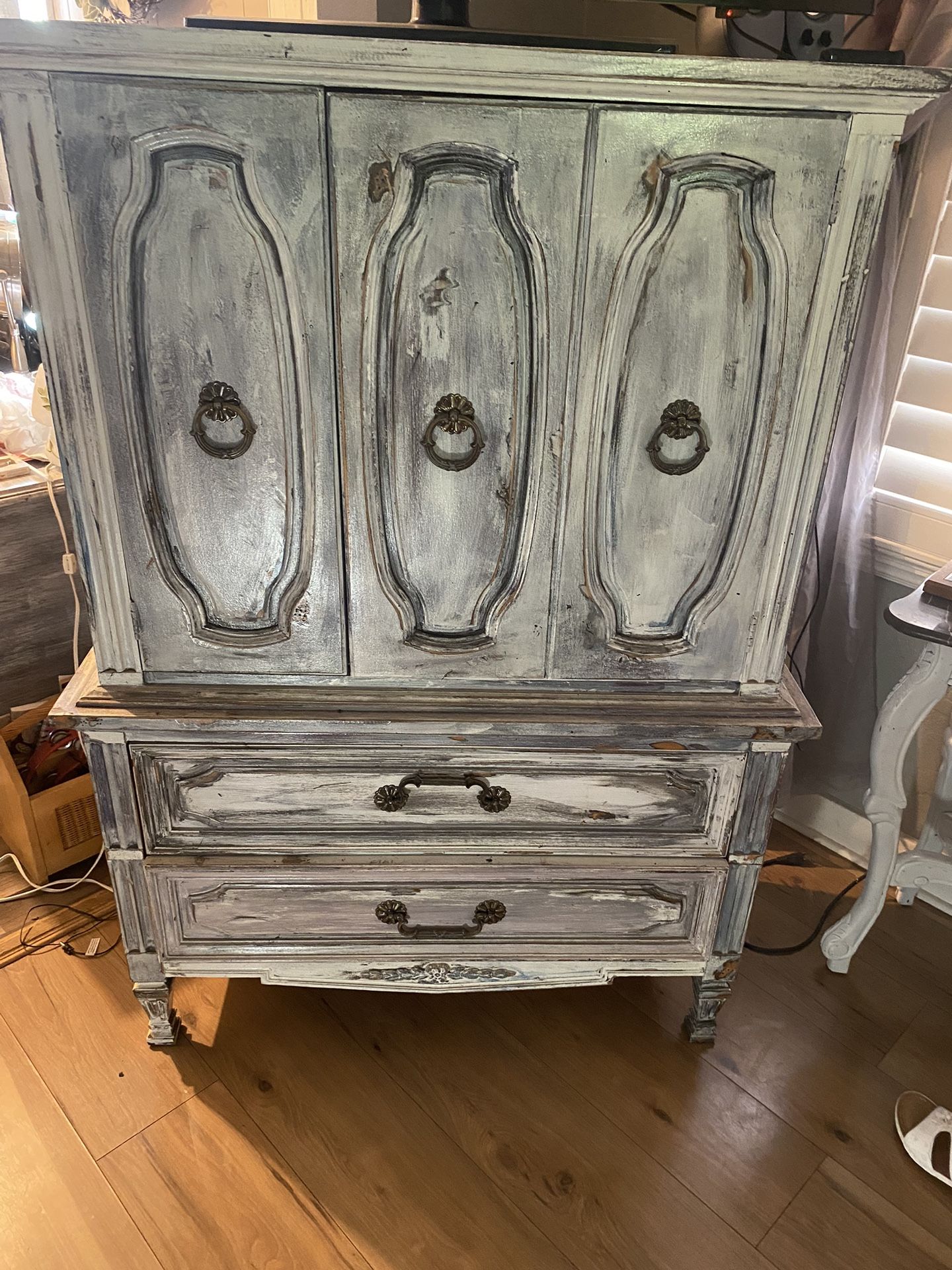 Dixie Armoire was Professionally Antiquated Distressed.