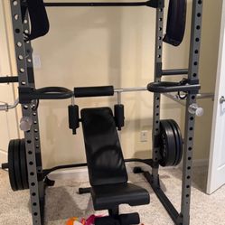 Power cage with pull-up bars and dip bars and 4 weight holders and weight bench