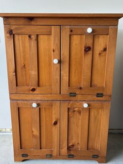 Triple tilt out trash cabinet
