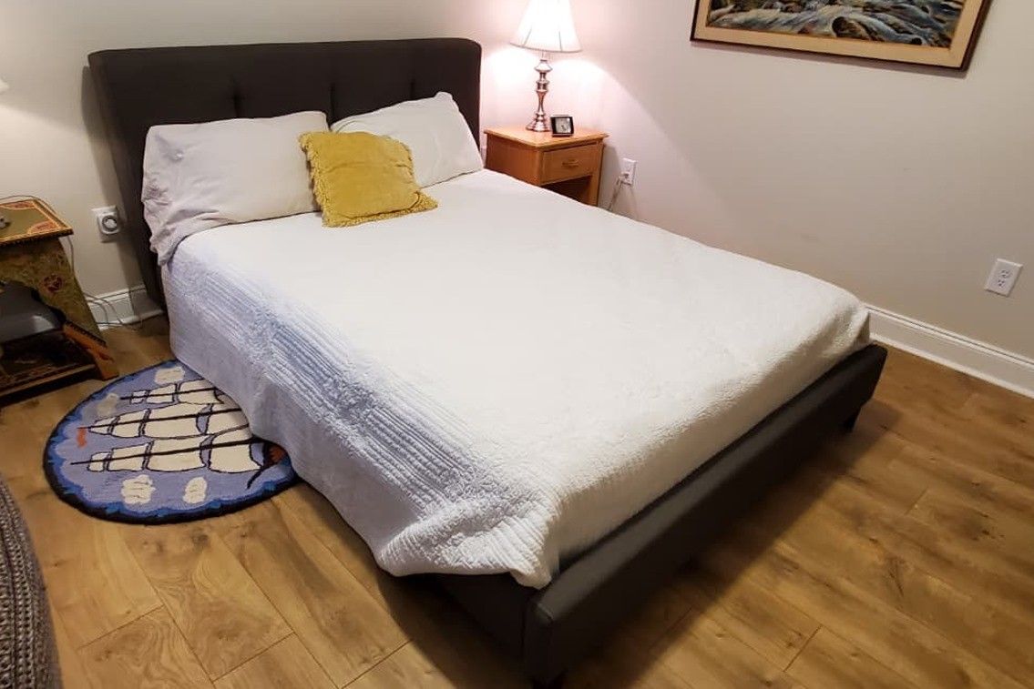 Queen bed w/ Matress, and 1 Night Table.