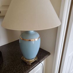 nice large lamp base is blue with gold trim works and looks great