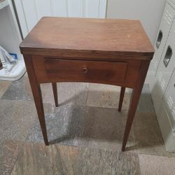 Sewing machine with table
