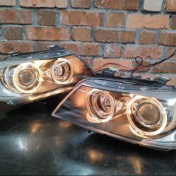 06-08 BMW 3 series OEM Headlights.