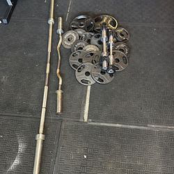 Olympic 7ft 45lbs bar plus 130lbs of Olympic weights and adjustable dumbbells plus cur bar