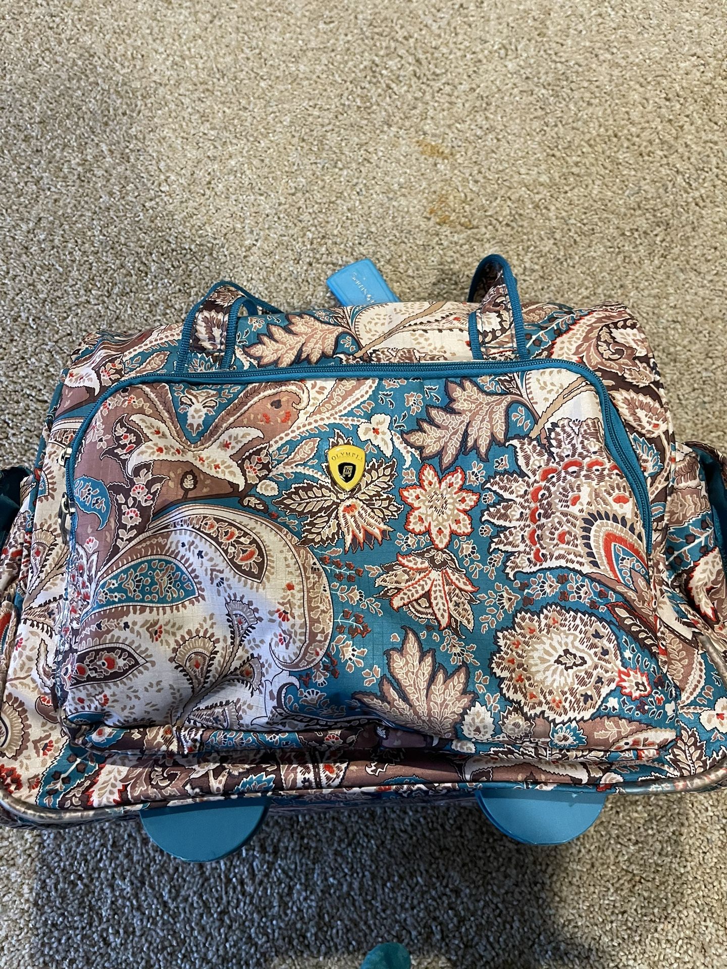 Beautiful Carry On Bag With Wheels. Hardly Used .