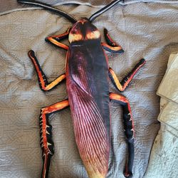 Unnecessarily realistic giant cockroach plush.