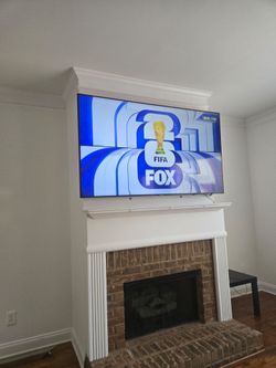 Large Flat Screen TV Wall Mounted. 75"