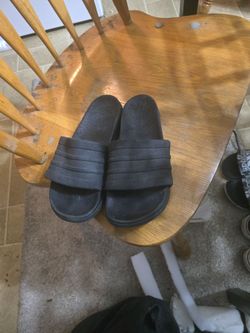 All black adidas slides