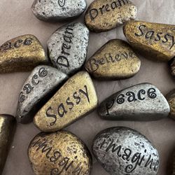 Gold And Silver Rocks Engraved With Messages