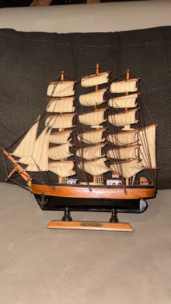vintage wooden ship flying cloud