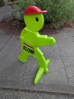 Slow for kids playing road sign cone alert