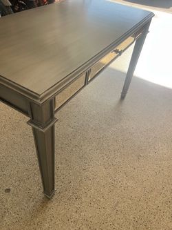 Silver desk with mirrored drawer