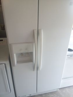 Side by side refrigerator with 30-day warranty and delivery included!!