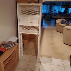 Moving downsizing over the toilet storage wicker