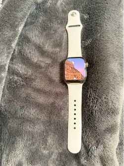 Apple Watch Series 11 42mm Gold Titanium with cellular (“CEL”) and the Light Blush sport band