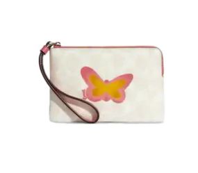 COACH BUTTERFLY CORNER ZIP WRISTLET IN SIGNATURE CANVAS & SMOOTH LEATHER
