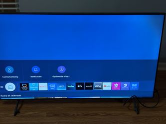 55" TV and another 32" TV, both with their remote controls