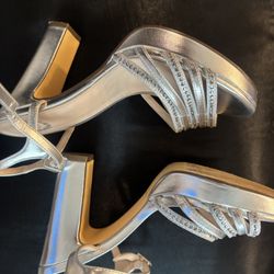I.Miller beautiful shoes they are sparkly silver, size 8 1/2, they have rhinestones on them. They’re very beautiful.