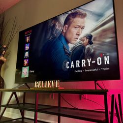 65inch TV, TV Stands & Gold “Believe” Sign