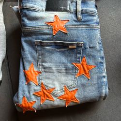 rock revivals and orange star amiri jeans