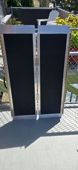 Folding aluminum ramp. Never used!