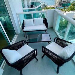 Beautiful Mercury Row Cangelosi 4-Piece Rattan/Wicker Sofa Seating Group, in excellent condition — perfect for balcony or patio use.