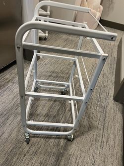 Metal rolling cart with glass shelves