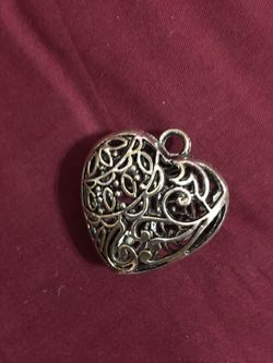 Heart framed silver colored pendant