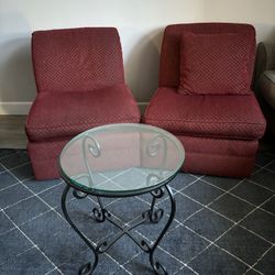 Two Armless Cushion Chairs and Glass Table