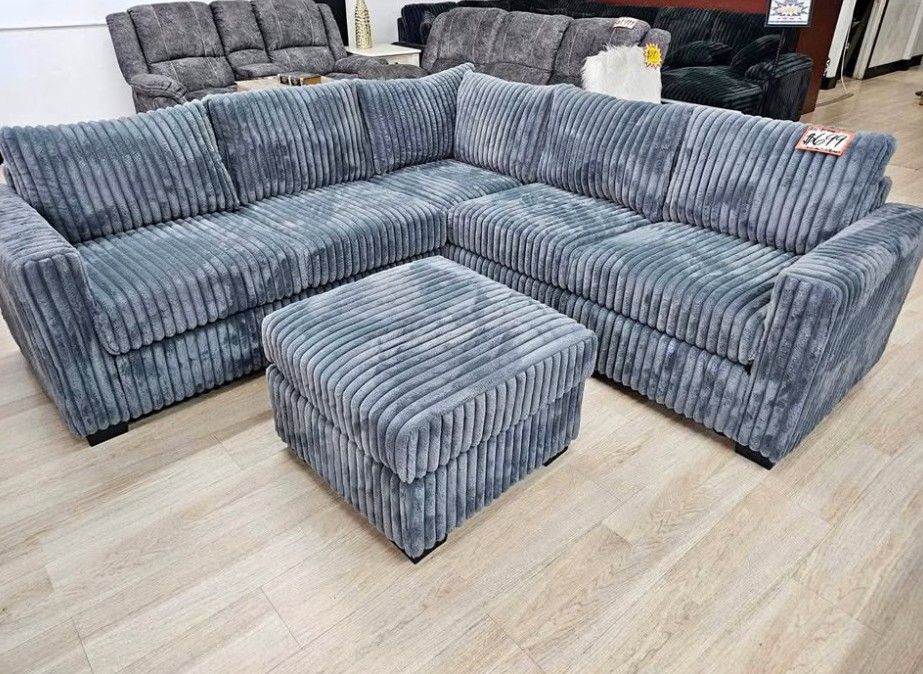 Gray Jumbo corduroy sectional sofa with ottoman