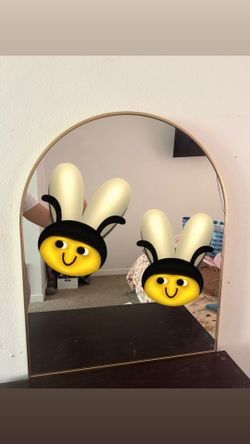 Gold arched mirror