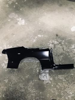 88-95 Chrysler LeBaron convertible left rear NOS quarter panel.