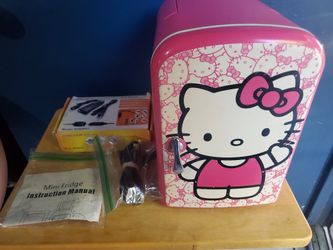 Hello kitty mini fridge really rare good condition pink cute works perfectly can fit 6 sodas and acouple waters
