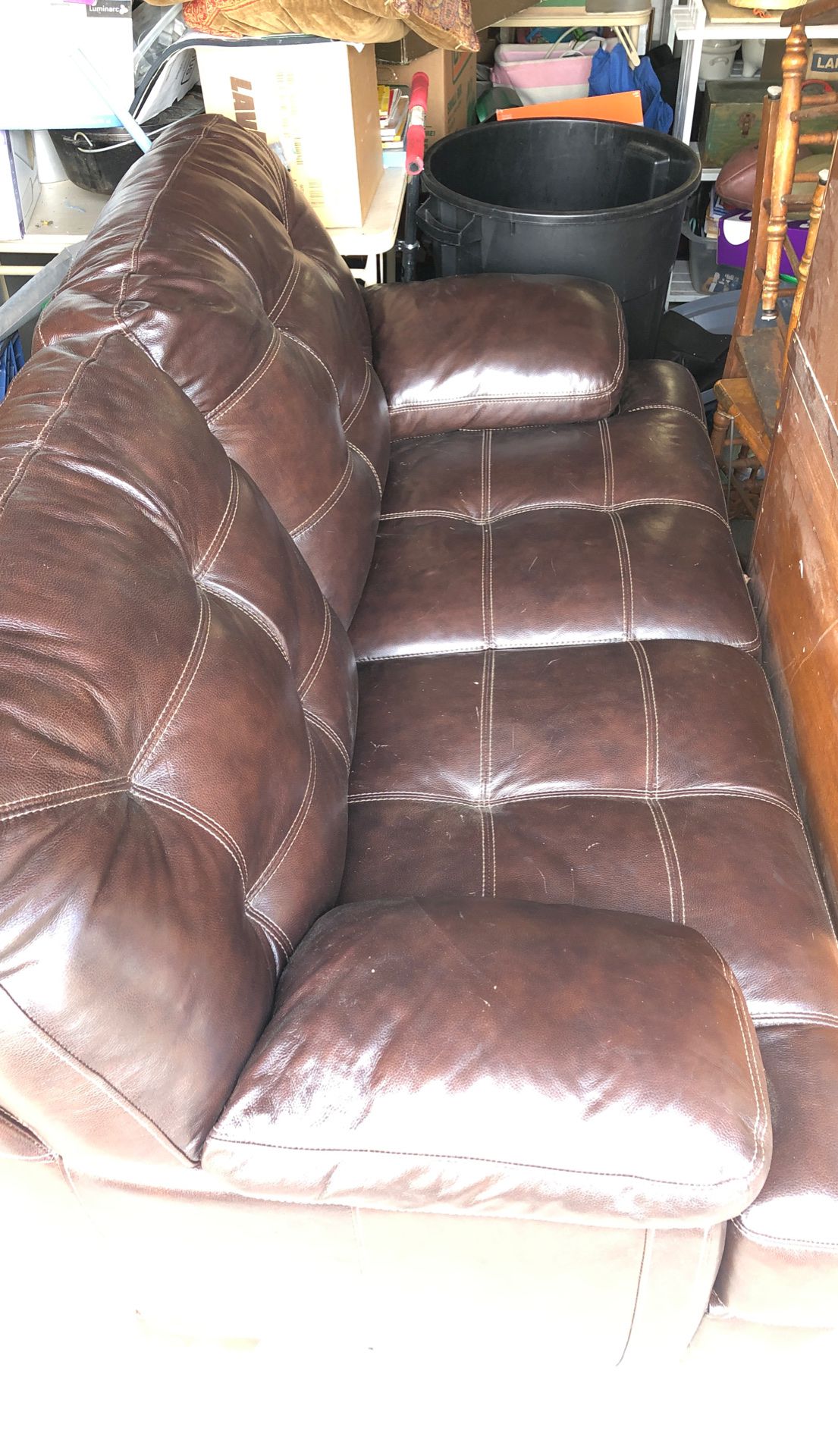 Brown leather loveseat